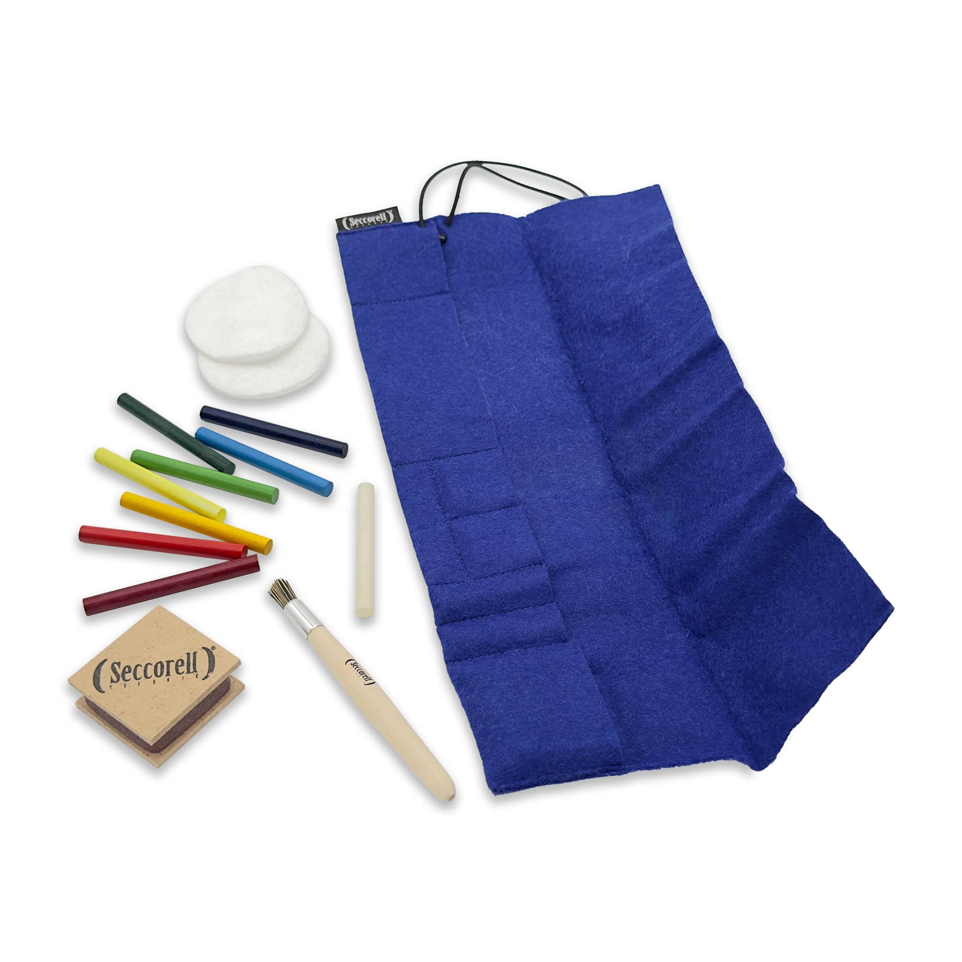 Contents of the Seccorell felt roller bag - paint sticks, rubbing block, cleaning brush and utensil compartment with cotton pads for creative projects.