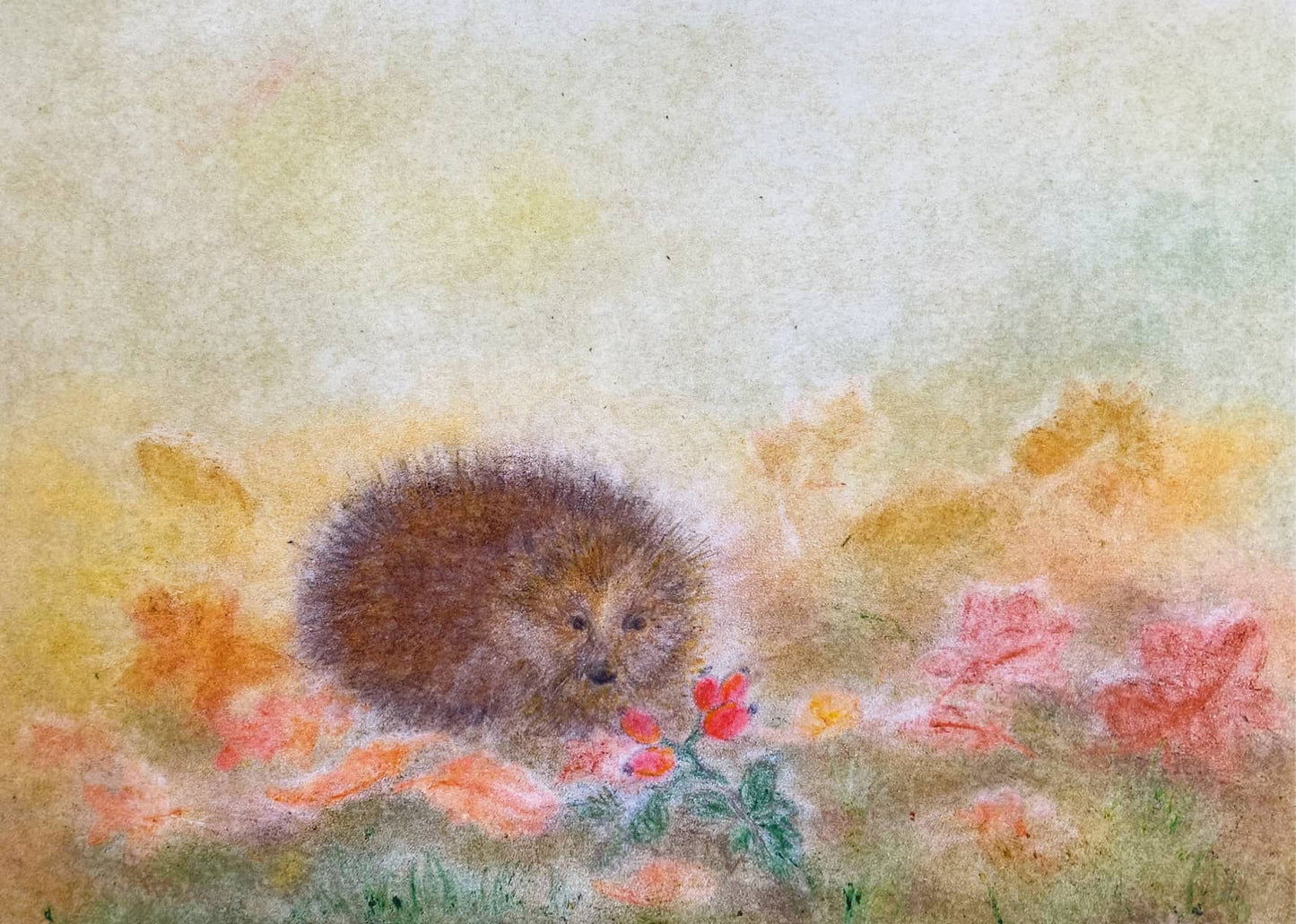 Little hedgehog in a colorful autumn landscape with falling leaves, designed in the Seccorell finger-wipe painting technique on the postcard "Hedgehog in Autumn" by Andrea Reiß.