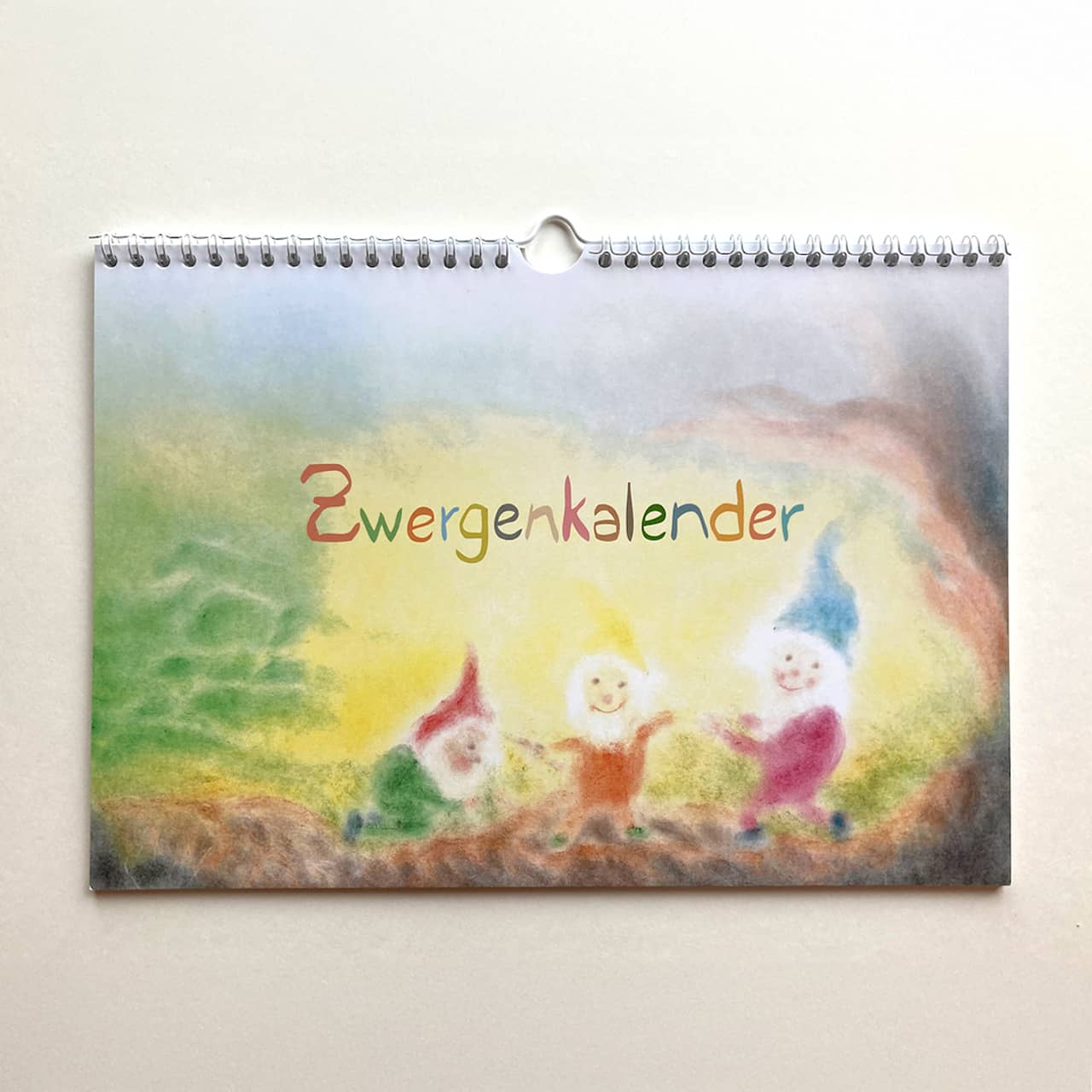 Cover page of the Seccorell dwarf calendar - colorfully painted dwarfs with a soft color gradient, designed in the typical Seccorell technique.